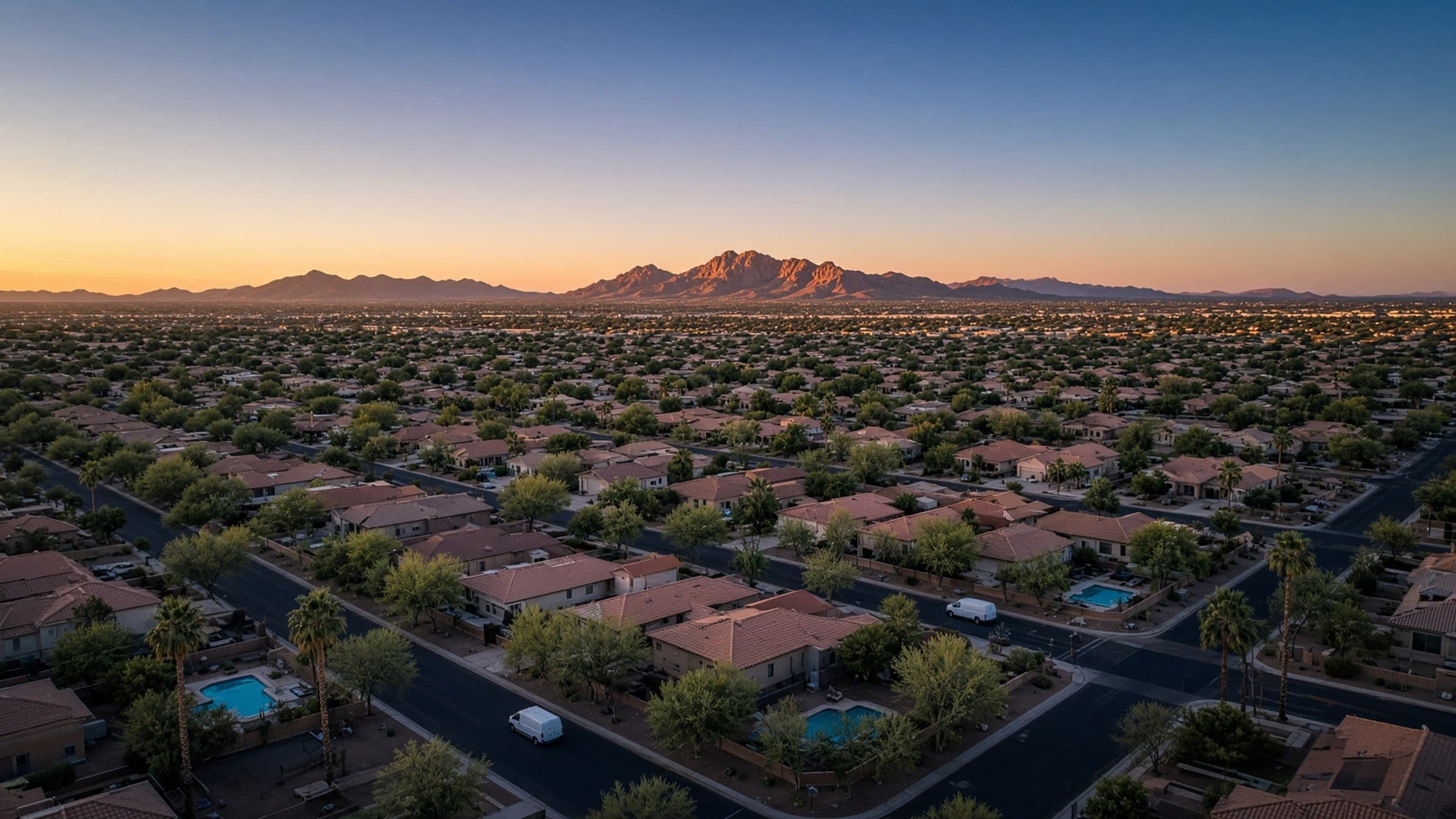 Phoenix neighborhood at dusk with mountains on the horizon